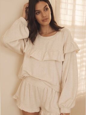 Anthropologie ruffle sweatshirt in Light Sand